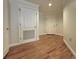 Neutral hallway featuring hardwood floors and white doors at 195 14Th St # 1005, Atlanta, GA 30309