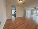 Bright living room with hardwood floors, open floor plan, and access to the kitchen at 195 14Th St # 1005, Atlanta, GA 30309