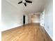 Open concept living room with hardwood floors, white walls, and two doorways at 195 14Th St # 1005, Atlanta, GA 30309