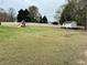 Expansive backyard features ample green space, a fence, and a charming shed at 2814 Michelle Lee Dr, Dacula, GA 30019