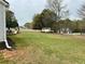 Expansive backyard with mature trees, play set and storage shed provides an outdoor retreat at 2814 Michelle Lee Dr, Dacula, GA 30019