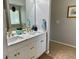 Bathroom featuring a dual sink vanity with marble countertop and gold hardware at 2814 Michelle Lee Dr, Dacula, GA 30019