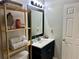 Cozy bathroom showcasing the single vanity and storage shelves at 2814 Michelle Lee Dr, Dacula, GA 30019