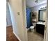 Hall bathroom features a single vanity, tile floor, and shower with stylish curtain at 2814 Michelle Lee Dr, Dacula, GA 30019
