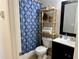 Bathroom showcasing the vanity, toilet, storage, and a stylish shower curtain at 2814 Michelle Lee Dr, Dacula, GA 30019