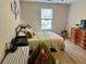 Bright bedroom features wood-look flooring and neutral paint to create a relaxing living space at 2814 Michelle Lee Dr, Dacula, GA 30019