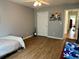 Bedroom with hardwood floors, a ceiling fan, a window and an art piece at 2814 Michelle Lee Dr, Dacula, GA 30019