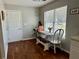 Cozy breakfast nook with natural light, hardwood floors, and a small table with a bench and chairs at 2814 Michelle Lee Dr, Dacula, GA 30019