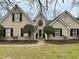 Charming brick home features a well-manicured lawn and mature landscaping for great curb appeal at 2814 Michelle Lee Dr, Dacula, GA 30019