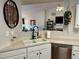Kitchen with double sink and stainless steel appliances, white cabinetry, and an open view to the living room at 2814 Michelle Lee Dr, Dacula, GA 30019