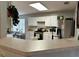 Bright kitchen with white cabinets, stainless appliances, and hardwood flooring, with a view into the breakfast nook at 2814 Michelle Lee Dr, Dacula, GA 30019