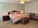 Spacious main bedroom with a cozy seating area, a decorative trunk, and carpet flooring for a relaxing retreat at 2814 Michelle Lee Dr, Dacula, GA 30019