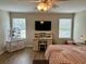 Serene bedroom with a desk, a comfortable bed, and two bright windows, creating a peaceful and productive space at 2814 Michelle Lee Dr, Dacula, GA 30019