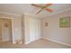 Bedroom with a closet, a ceiling fan, carpet flooring, and neutral paint at 4495 Glengary Ne Dr, Atlanta, GA 30342