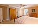 Comfortable bedroom with built-ins, a ceiling fan, shutters and crown molding at 4495 Glengary Ne Dr, Atlanta, GA 30342