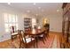 Charming dining room featuring hardwood floors, white trim, recessed lights and a colorful rug at 4495 Glengary Ne Dr, Atlanta, GA 30342
