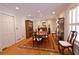Elegant dining room showcasing a hardwood floor, shutters, recessed lights, and ornate oriental rug at 4495 Glengary Ne Dr, Atlanta, GA 30342