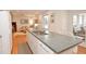 Bright kitchen showcasing a large island, stainless steel appliances, and an open layout connected to living spaces at 4495 Glengary Ne Dr, Atlanta, GA 30342