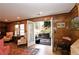 Living room with wood paneled walls, recessed lights, hardwood floors, and French doors to the patio at 4495 Glengary Ne Dr, Atlanta, GA 30342