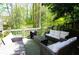 Cozy patio features comfortable seating, perfect for outdoor relaxation and enjoying the beautiful wooded scenery at 4495 Glengary Ne Dr, Atlanta, GA 30342