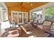 Beautiful sunroom with lots of sunlight, vaulted ceilings and wicker furniture; perfect for relaxation and entertaining at 4495 Glengary Ne Dr, Atlanta, GA 30342