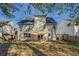 A spacious backyard with a covered patio, perfect for outdoor entertaining and relaxation at 4975 Skyland Pkwy, Cumming, GA 30028
