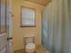 Bathroom featuring standard toilet, tile flooring, and a shower with a curtain at 4975 Skyland Pkwy, Cumming, GA 30028