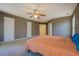 Bedroom with neutral walls, carpet, ceiling fan, and natural light at 4975 Skyland Pkwy, Cumming, GA 30028