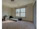 Bright bedroom with a window, closet, and carpet flooring at 4975 Skyland Pkwy, Cumming, GA 30028