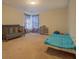 Bedroom with crib and bed with natural light and colorful curtains at 4975 Skyland Pkwy, Cumming, GA 30028