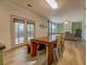 Dining Room with Hardwood floors, French Doors to Backyard and view into Living Room at 4975 Skyland Pkwy, Cumming, GA 30028