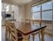 Cozy dining room featuring a wooden table, comfortable seating for six, and generous natural light at 4975 Skyland Pkwy, Cumming, GA 30028