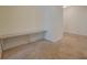 Hallway with carpet and built-in shelving at 4975 Skyland Pkwy, Cumming, GA 30028