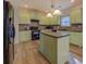 Modern kitchen with island, stainless steel appliances, and abundant counter space at 4975 Skyland Pkwy, Cumming, GA 30028