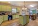 Stylish kitchen with island, stainless steel appliances, and contemporary finishes at 4975 Skyland Pkwy, Cumming, GA 30028