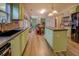 Open concept kitchen with island, stainless appliances, and modern countertops at 4975 Skyland Pkwy, Cumming, GA 30028