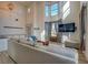 Expansive living area with high ceilings, ample natural light, and elegant decor at 4975 Skyland Pkwy, Cumming, GA 30028
