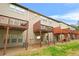Townhomes with outdoor decks overlooking small backyard areas at 5669 Cobblestone Creek Pl # 12, Mableton, GA 30126