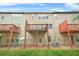 Exterior view of a multi-story home with individual decks and a backyard at 5669 Cobblestone Creek Pl # 12, Mableton, GA 30126