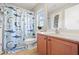 Bathroom featuring a white vanity, toilet, and shower with a shark themed shower curtain at 5669 Cobblestone Creek Pl # 12, Mableton, GA 30126
