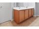 Bathroom vanity with wood cabinets, double sinks, and tan tile flooring at 5669 Cobblestone Creek Pl # 12, Mableton, GA 30126