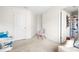 Bedroom area featuring gray walls, carpeted floor, and fun decor at 5669 Cobblestone Creek Pl # 12, Mableton, GA 30126