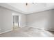 Bright bedroom with a tray ceiling with an ensuite bathroom featuring a tub at 5669 Cobblestone Creek Pl # 12, Mableton, GA 30126