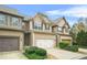 Inviting two-story townhome with a well-maintained front lawn and convenient garage at 5669 Cobblestone Creek Pl # 12, Mableton, GA 30126