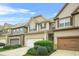 Charming two-story townhome with a well-manicured front yard and attached garage at 5669 Cobblestone Creek Pl # 12, Mableton, GA 30126