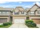 Charming two-story townhome with a well-manicured front yard and attached garage at 5669 Cobblestone Creek Pl # 12, Mableton, GA 30126