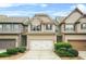 Charming two-story townhome with a well-manicured front yard and attached garage at 5669 Cobblestone Creek Pl # 12, Mableton, GA 30126