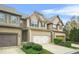 Inviting two-story townhome with a well-maintained front lawn and convenient garage at 5669 Cobblestone Creek Pl # 12, Mableton, GA 30126