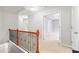 Hallway with wooden banister leading to bedrooms and bathrooms at 5669 Cobblestone Creek Pl # 12, Mableton, GA 30126