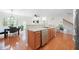 Functional kitchen area, adjacent to a dining area with stainless steel appliances and an island with a sink at 5669 Cobblestone Creek Pl # 12, Mableton, GA 30126